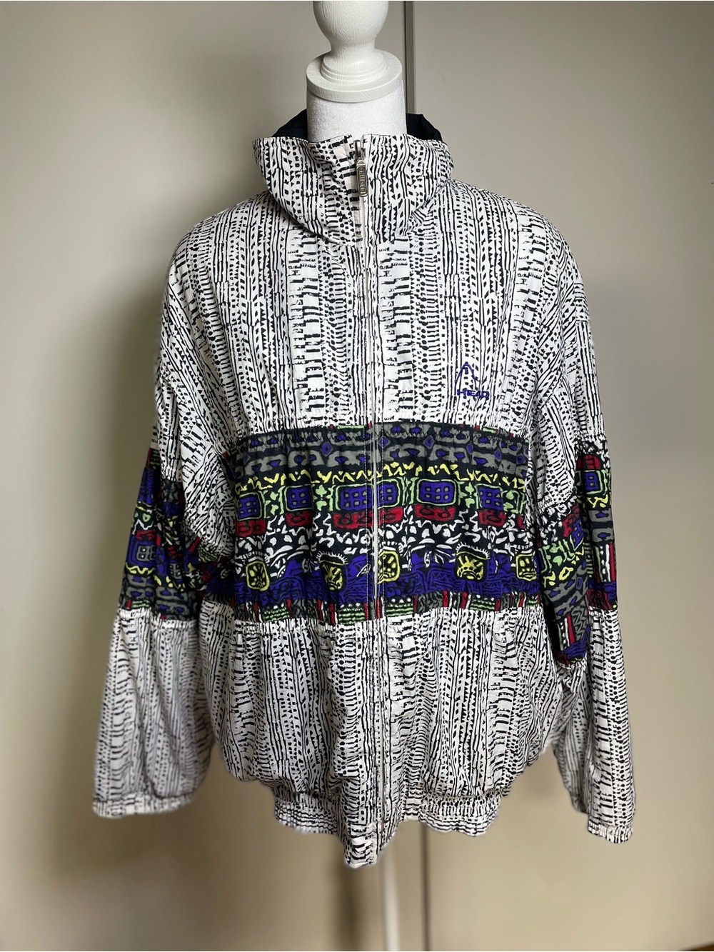 Head White Windbreaker with Multicolor Geometric Band